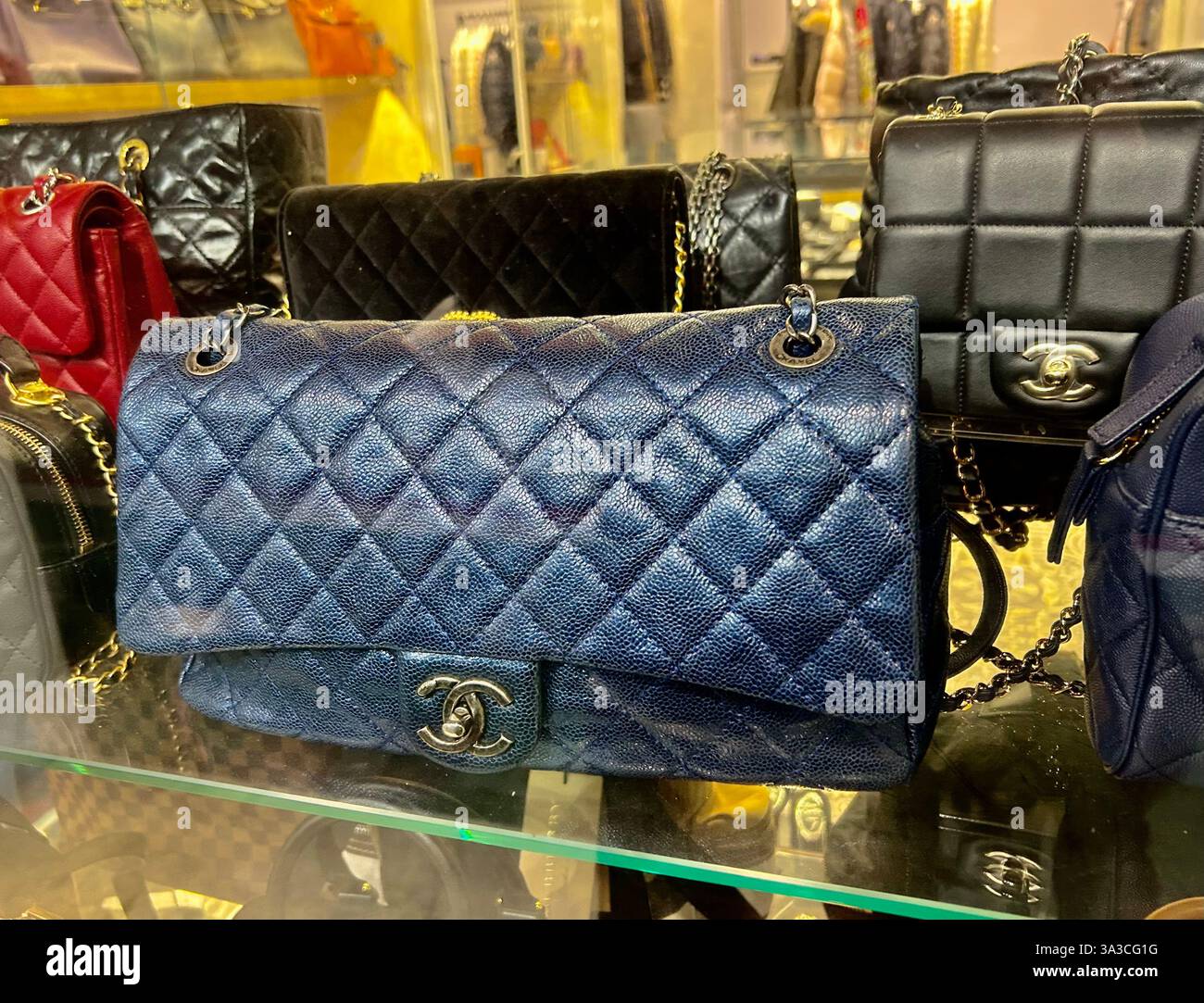 Taipei, Taiwan, Close up, Chanel Bags on display in VIntage shop Window, chanel handbags store - Smartphone Captured Stock Image