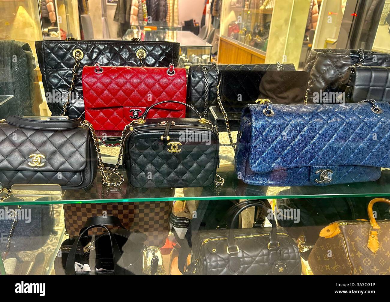 Taipei, Taiwan, Close up, Chanel Bags on display in VIntage shop Window, shopping bag, vuitton chanel chanel handbags store - Smartphone Captured Stock Image