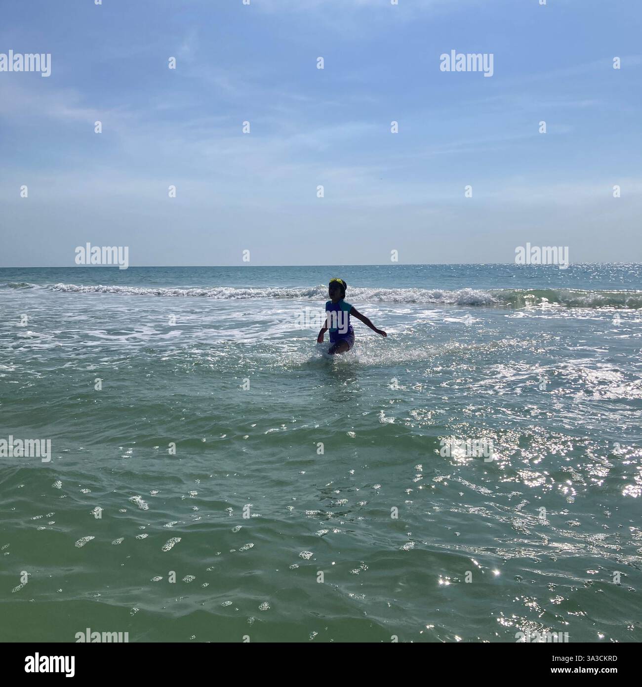 People frolic in the ocean in Florida, USA - Smartphone Captured Stock Image