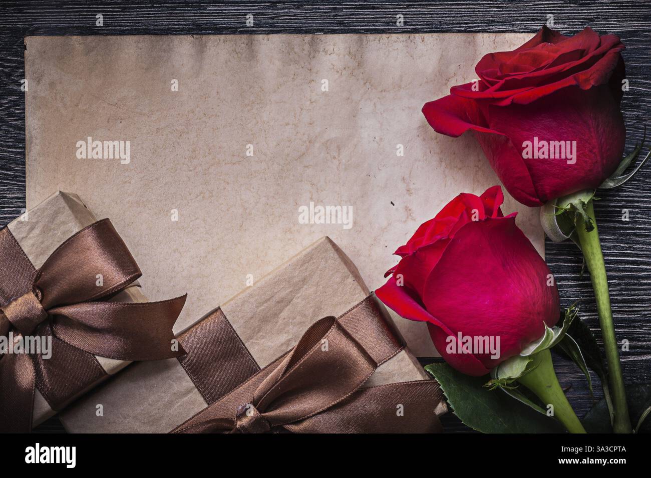 Vintage blank paper red natural roses present boxes Stock Photo - Alamy