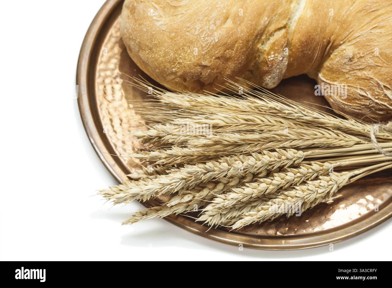 Wheat ears loaf of bread on vintage brass tray isolated white Stock ...