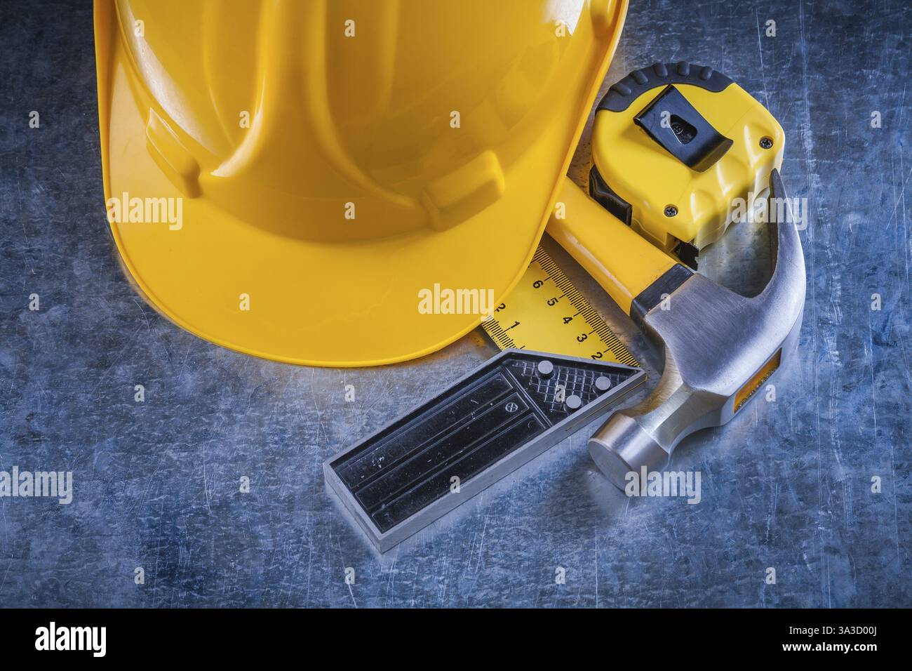Square ruler measuring tape building helmet and claw hammer on ...