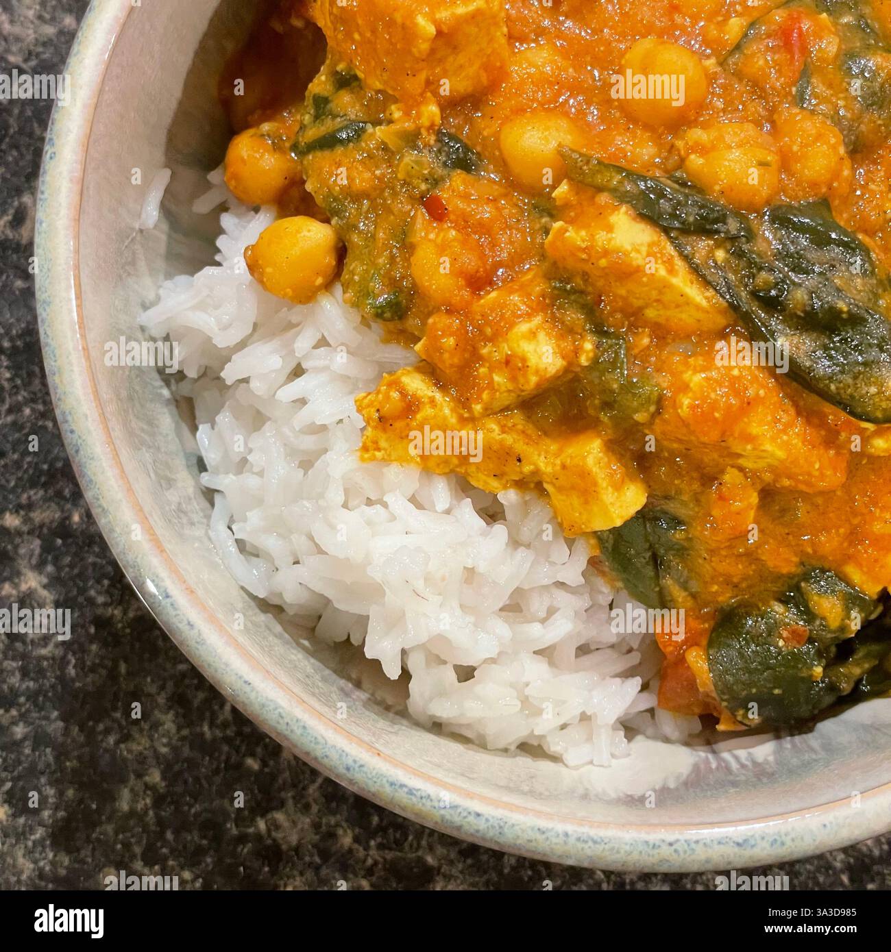 Tofu and chickpea curry with spinach and rice - Smartphone Captured Stock Image