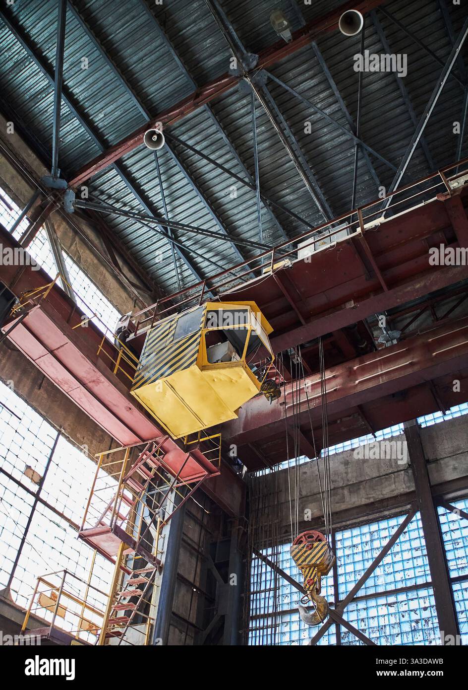 yellow Industrial crane cabin inside factory Stock Photo - Alamy