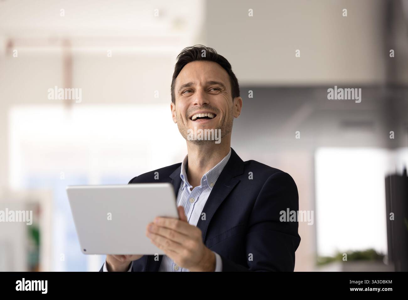 Happy business executive man using digital tablet for work Stock Photo