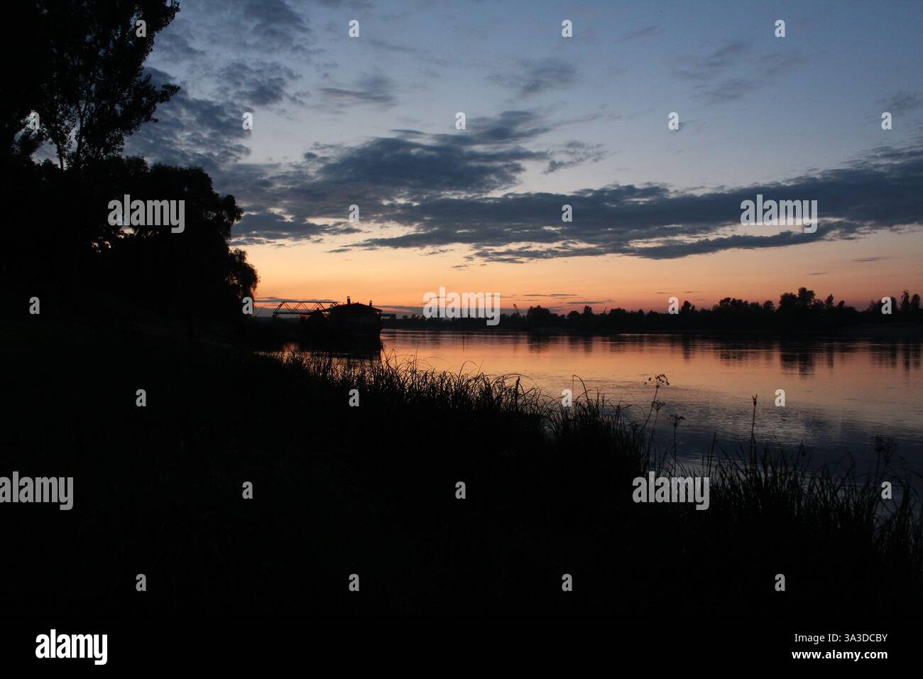 Sunset sky, white pink clouds and blue sky. Stock Photo