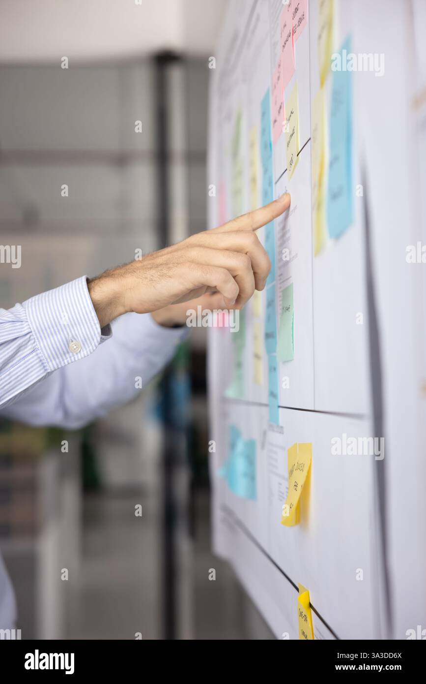 Hands of two businessmen working on project tasking Stock Photo