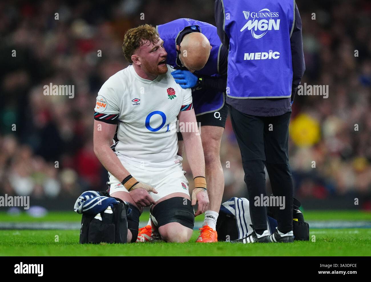 England's Ollie Chessum receives treatment for an injury during the ...