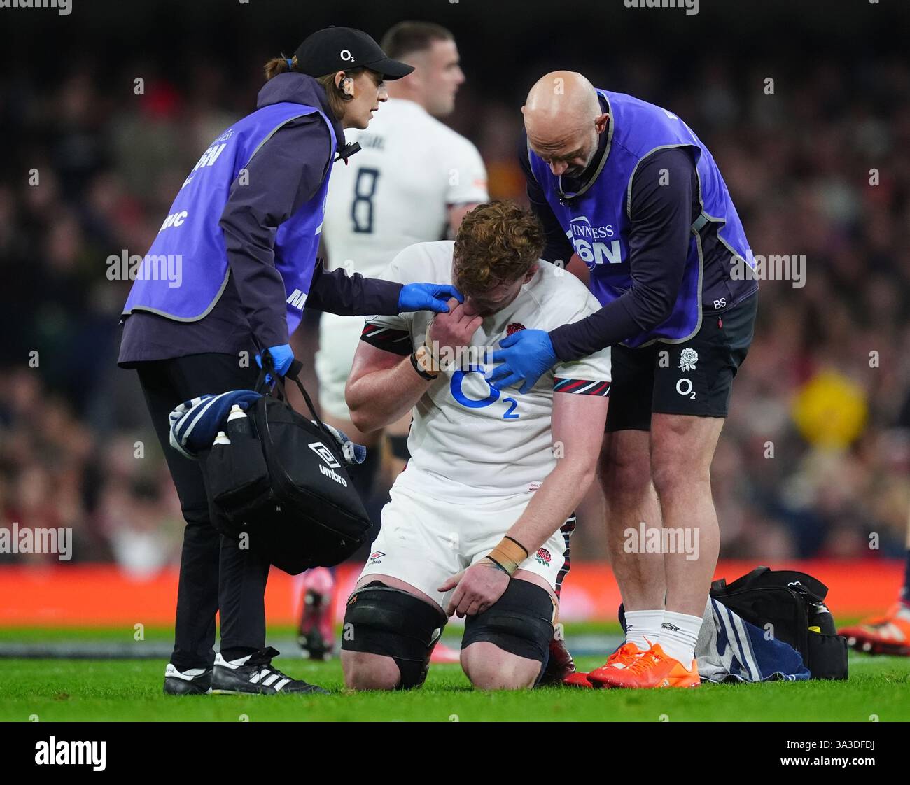 England's Ollie Chessum receives treatment for an injury during the ...