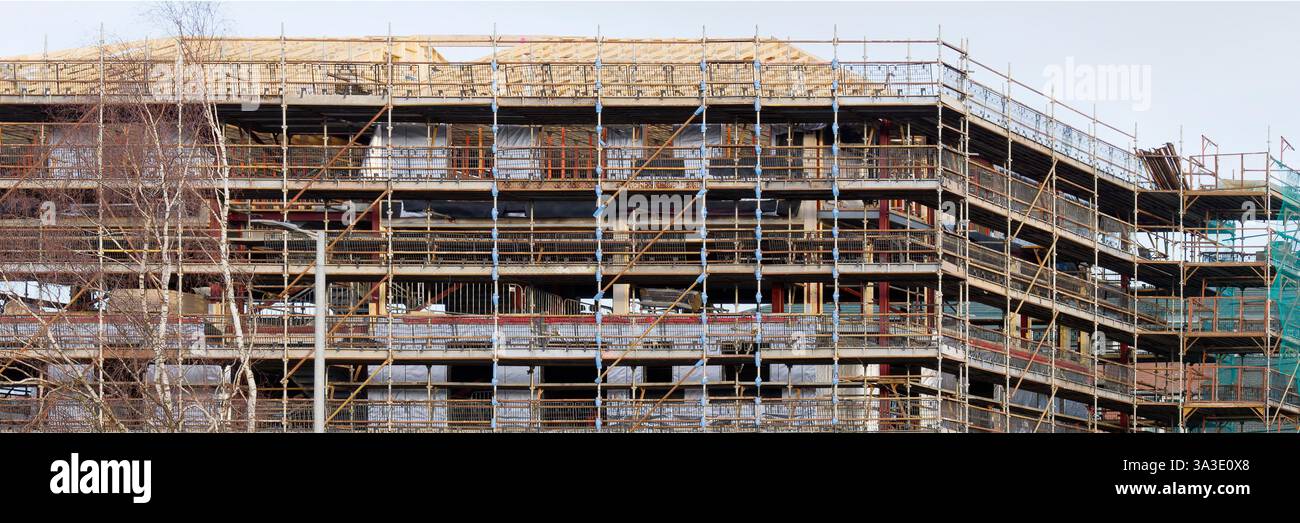 Scaffolding surrounding residential development for safe access to ...