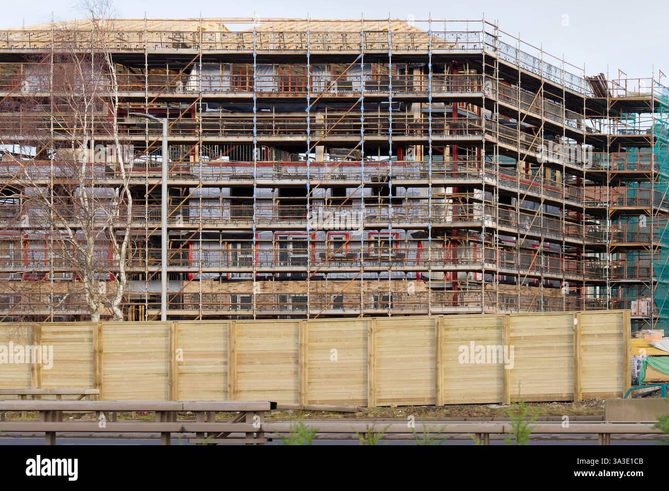Scaffolding surrounding residential development for safe access to ...