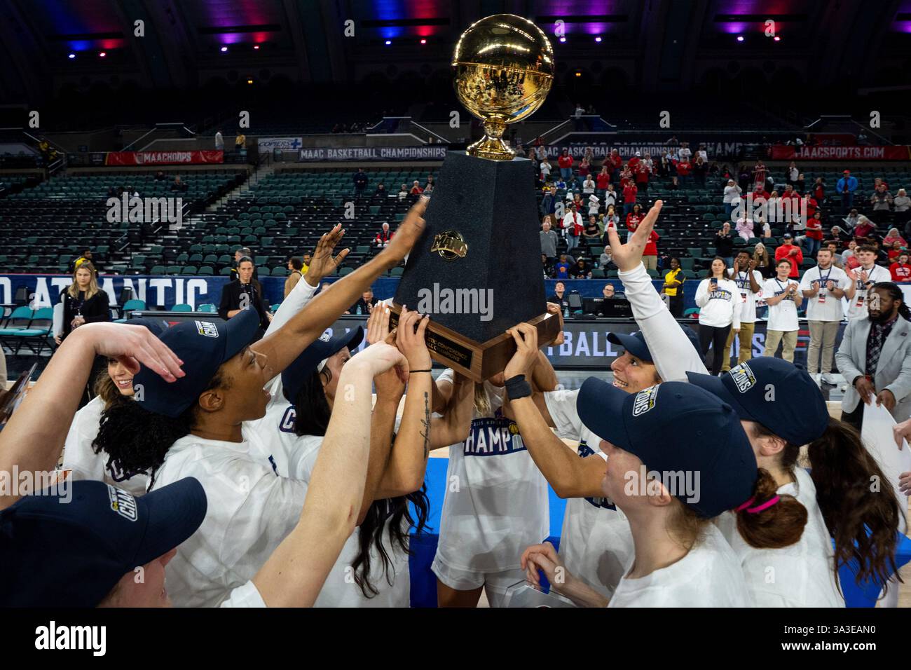 Fairfield lifts up the MAAC trophy following the NCAA college basketball game in the