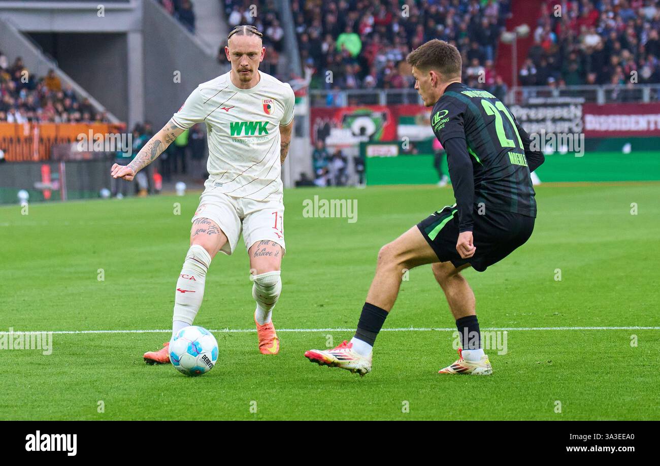 Mwolf Marius Wolf, FCA 11 compete for the ball, tackling, duel, header ...