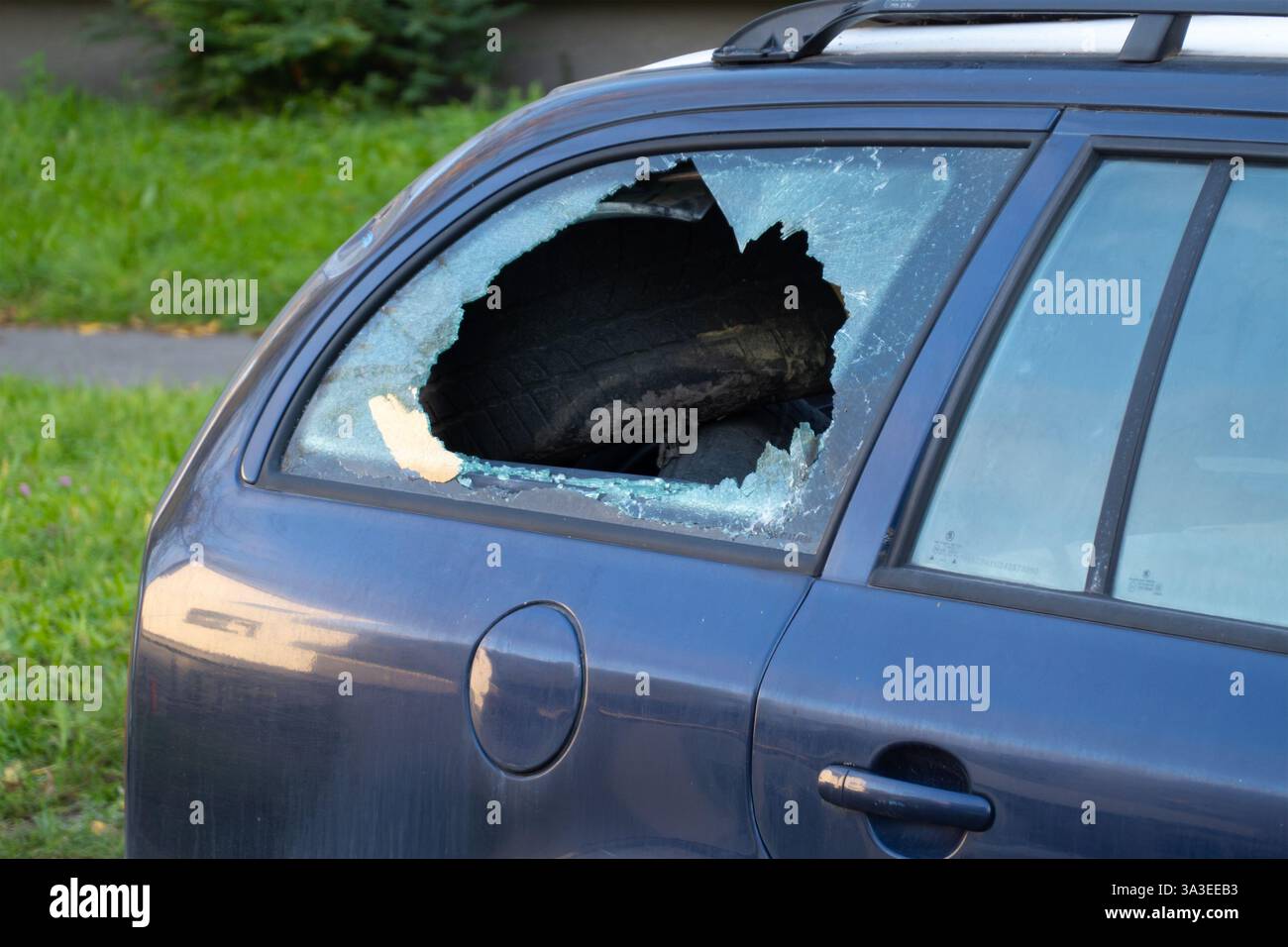 Car Rear Window Shattered Car break-in with broken smashed rear window in blue estate vehicle ...