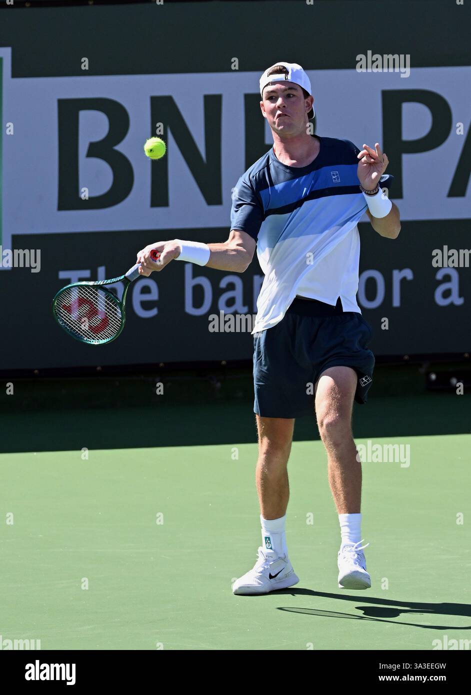 INDIAN WELLS, CA - MARCH 15: Jagger Leach (USA) returns the ball during ...