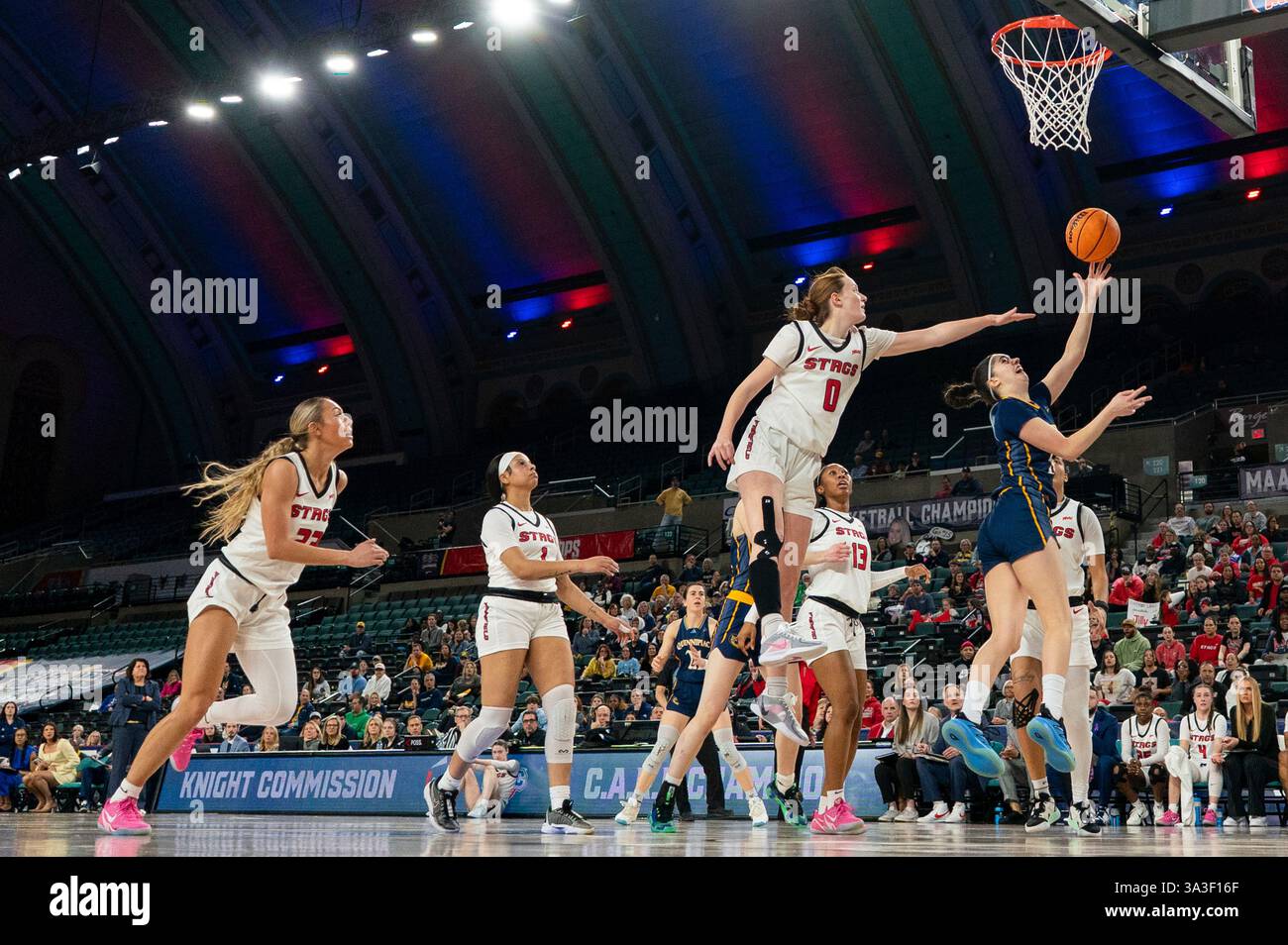 Quinnipiac's Gal Raviv, right, goes up for the shot as she gets past ...
