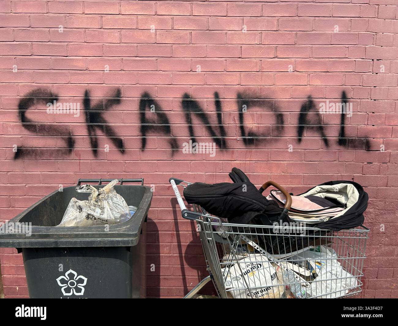 Skandal graffiti on a brick wall - Smartphone Captured Stock Image