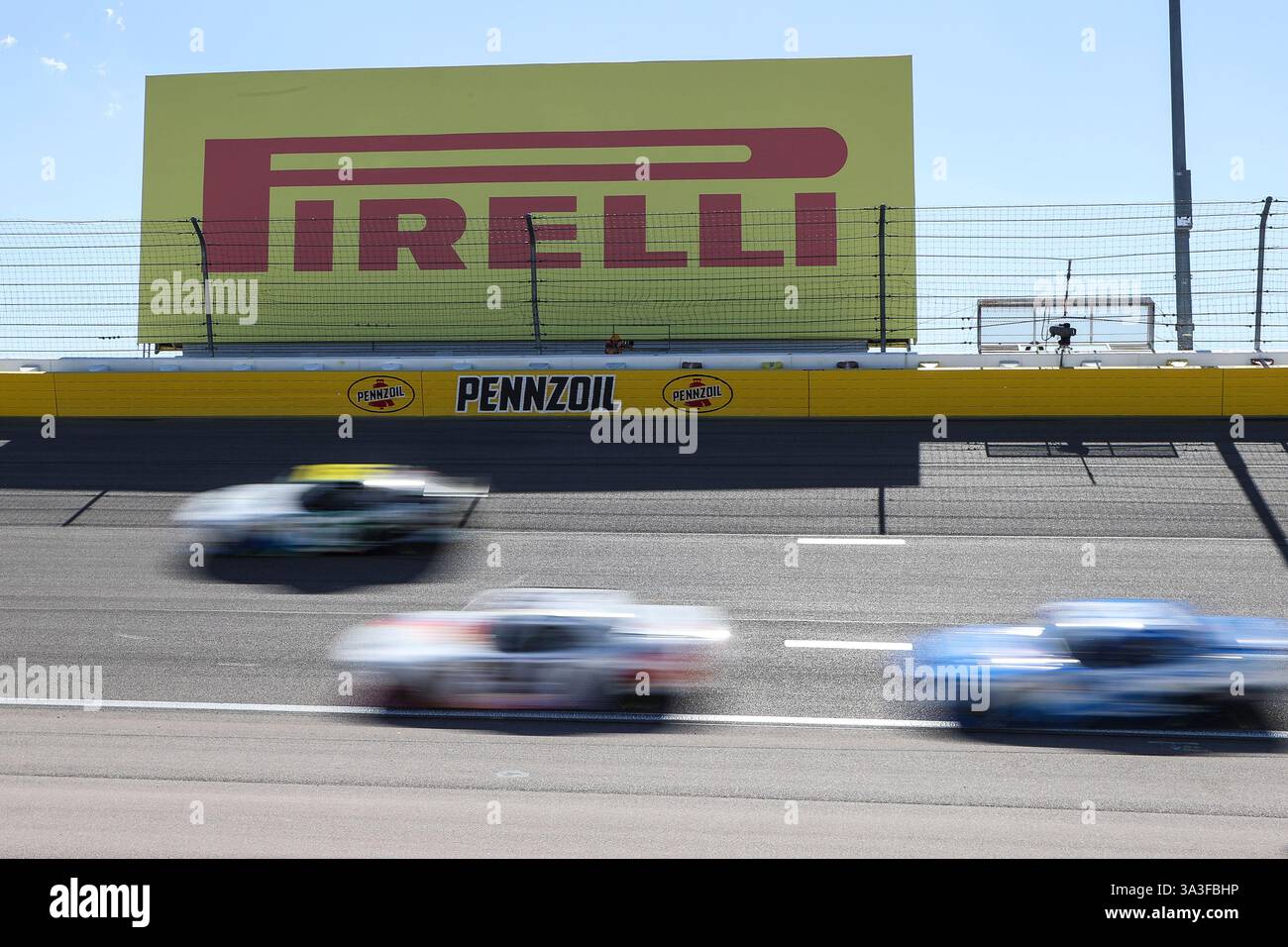 LAS VEGAS, NV - MARCH 15: Cars drive through turn one during the NASCAR ...