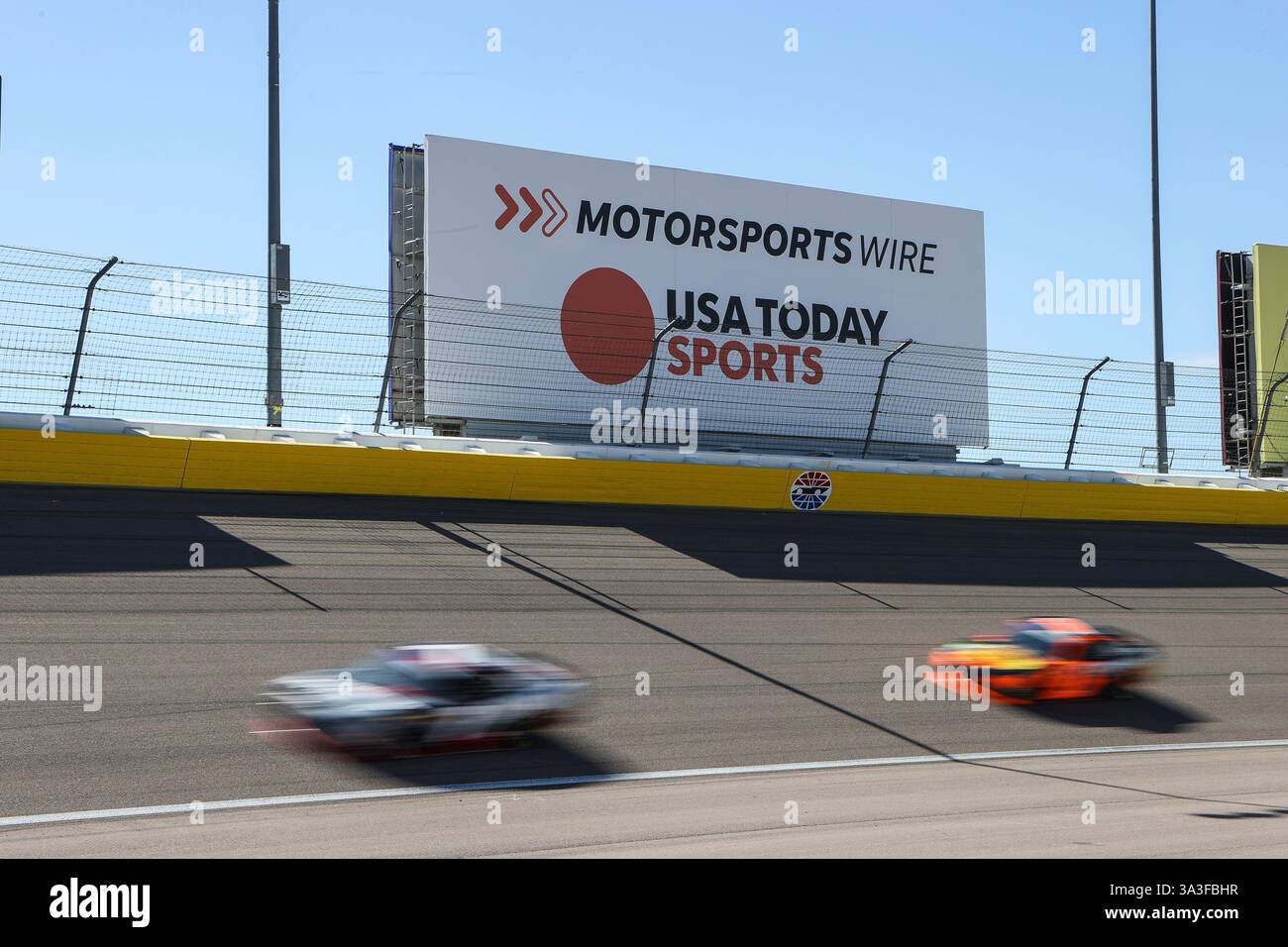 LAS VEGAS, NV - MARCH 15: Cars drive through turn one during the NASCAR ...