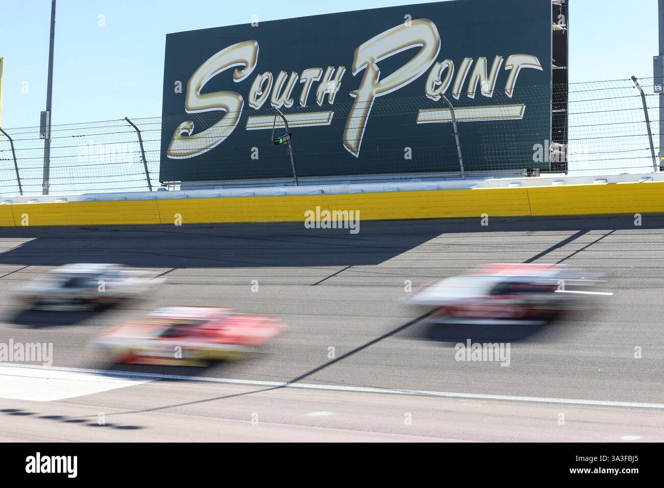 LAS VEGAS, NV - MARCH 15: Cars drive through turn one during the NASCAR ...