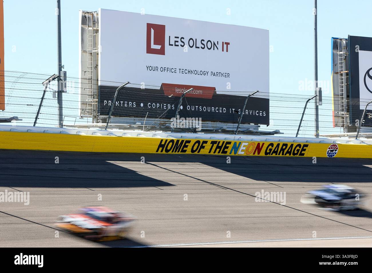 LAS VEGAS, NV - MARCH 15: Cars drive through turn one during the NASCAR ...