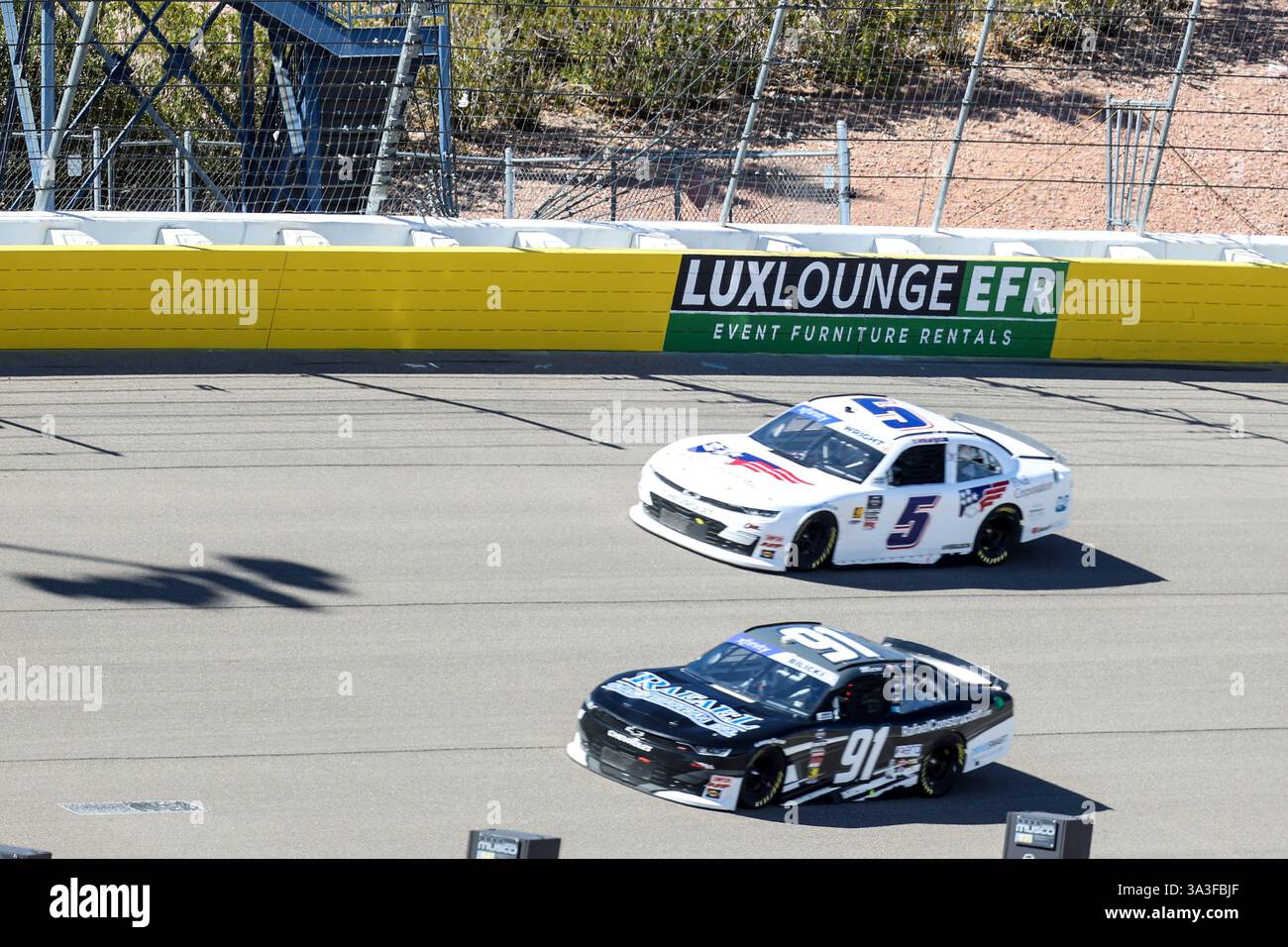 LAS VEGAS, NV - MARCH 15: Cars drive through into turn one during the ...