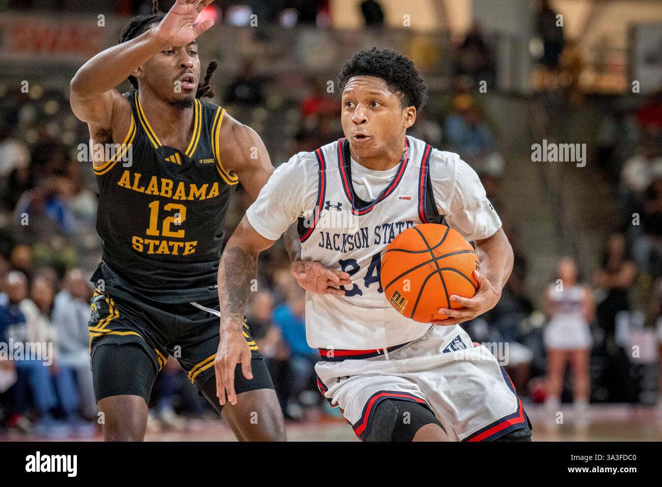 Jackson State guard Daeshun Ruffin, right, dribbles against Alabama ...