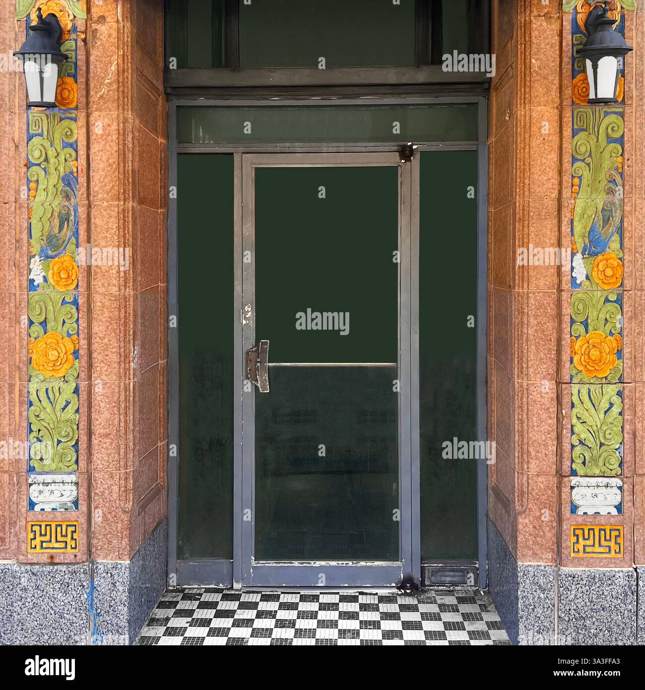 A historic entrance in Chicago’s Chinatown with intricate glazed terracotta tilework featuring floral patterns, birds, and traditional Chinese motifs - Smartphone Captured Stock Image