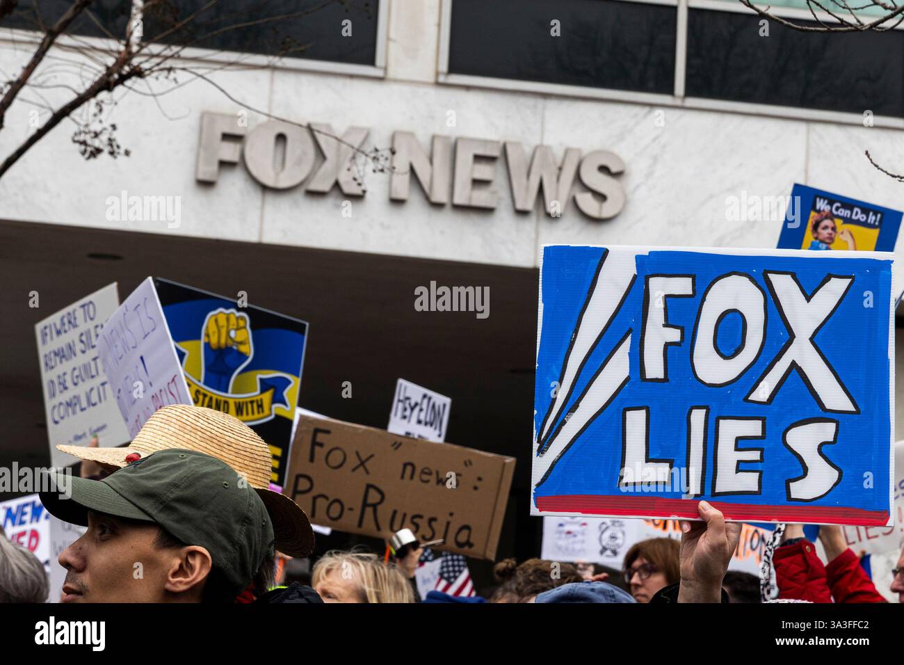 Hundreds of protesters gather and protest in front of the Fox News Washington, D.C., bureau on