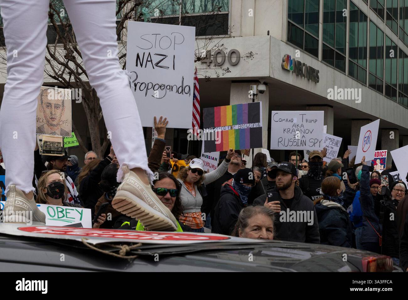 Hundreds of protesters gather and protest in front of the NBC News, and Fox News Washington, D.C