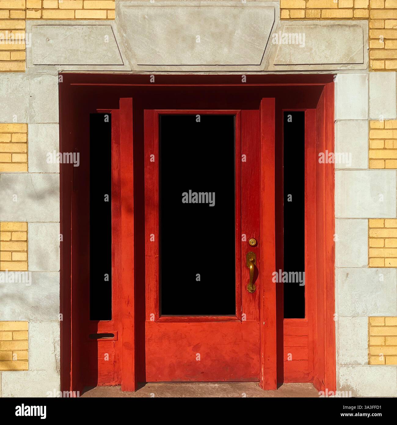 Red doorways within a classic brick and stone facade in Chicago with the warm yellow bricks and light. - Smartphone Captured Stock Image