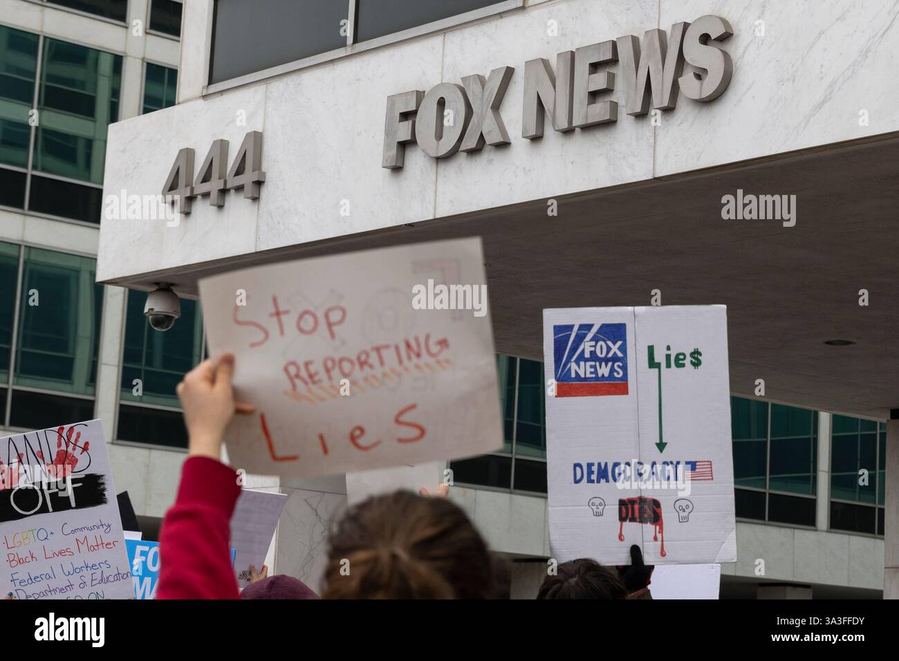 Hundreds of protesters gather and protest in front of the Fox News Washington, D.C., bureau on