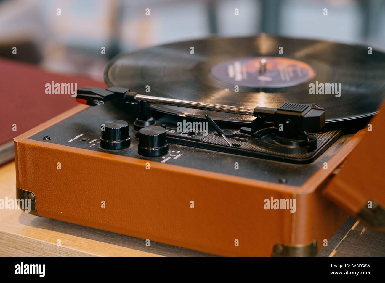 Vintage turntable spinning a vinyl record Warm hues and classic design ...
