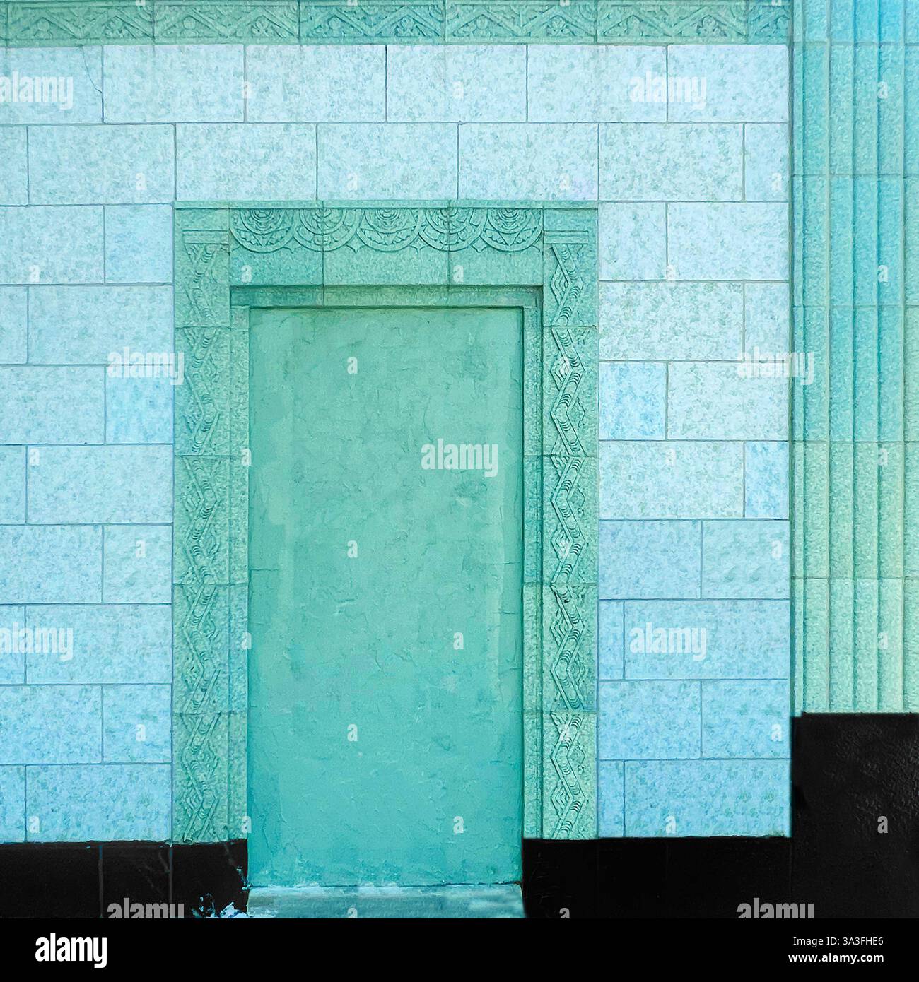 A sealed doorway surrounded by intricate green-glazed terra cotta tiles, showcasing the elegance of historic architectural tilework in Chicago. - Smartphone Captured Stock Image