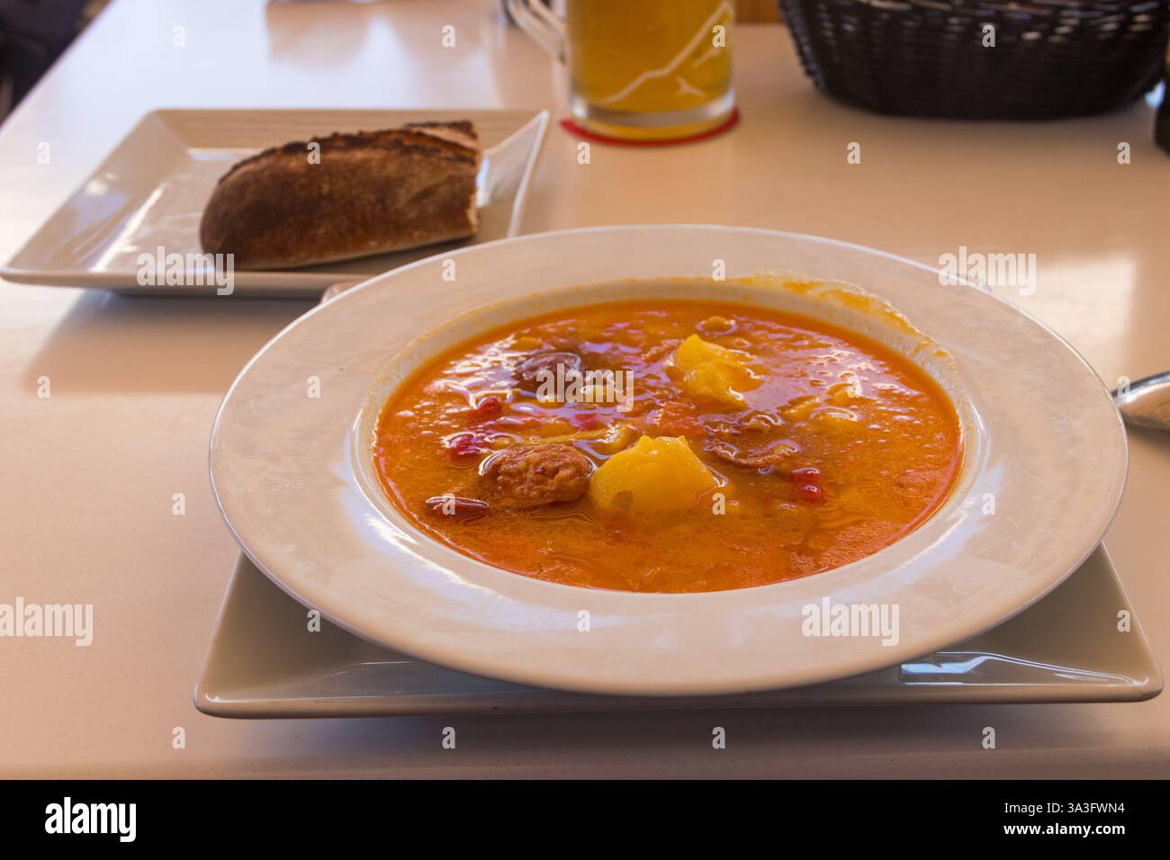 Canarian soup on a table in a restaurant Stock Photo