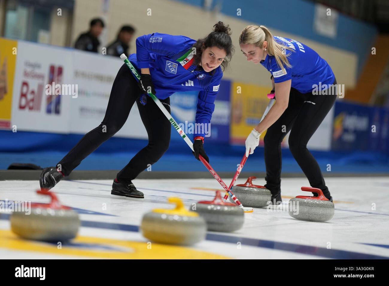 Italy's Elena Mathis and Italy's Angela Romei sweep during the match ...