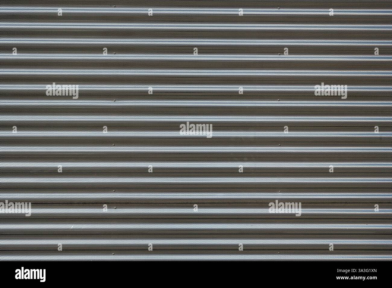 Background from a corrugated silver metal sheet Stock Photo
