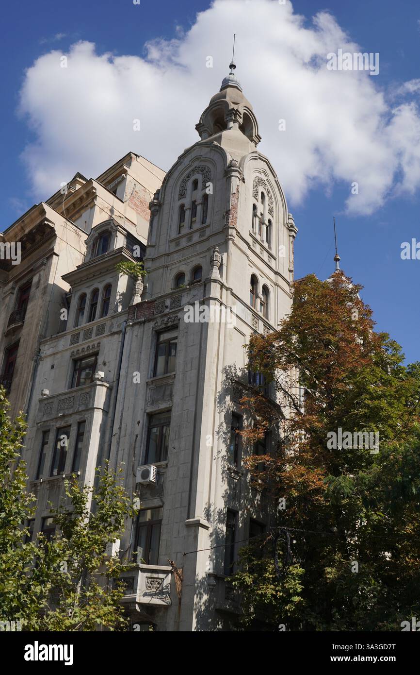 Old building with elements of neo-romanian architectural style in Bucharest Stock Photo