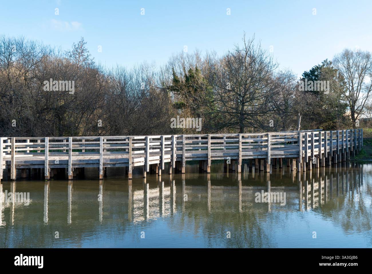 Wooden bridge across hi-res stock photography and images - Alamy