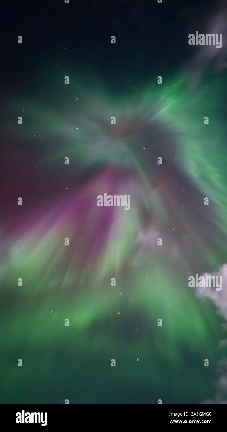 Vibrant Northern Lights display in the night sky - Smartphone Captured Stock Image