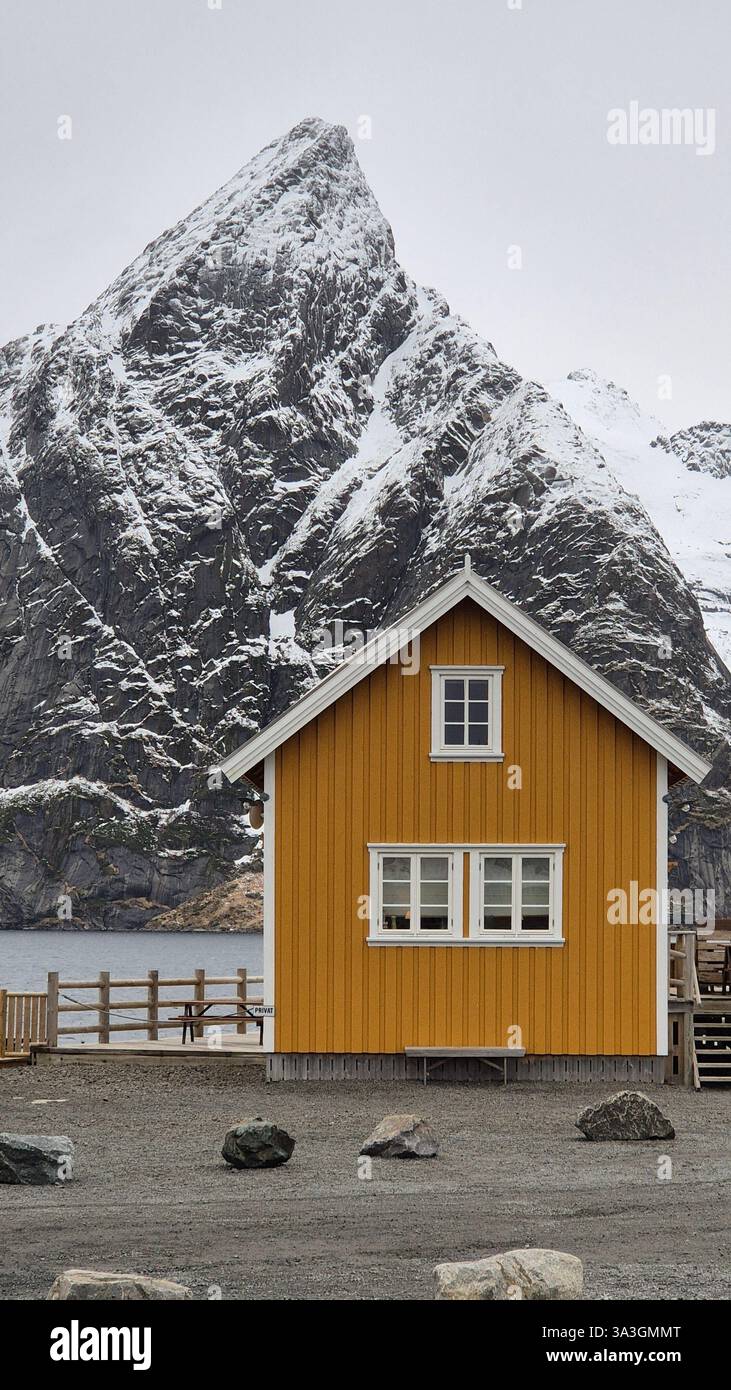 Cozy wooden cabin in a snowy mountain landscape, Norway Stock Photo