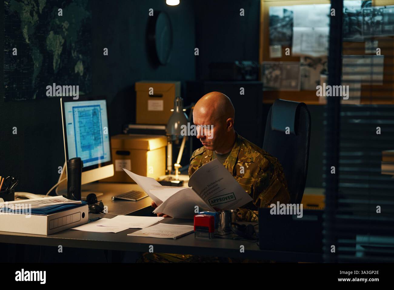Analyzing Classified Documents in Military Office Stock Photo