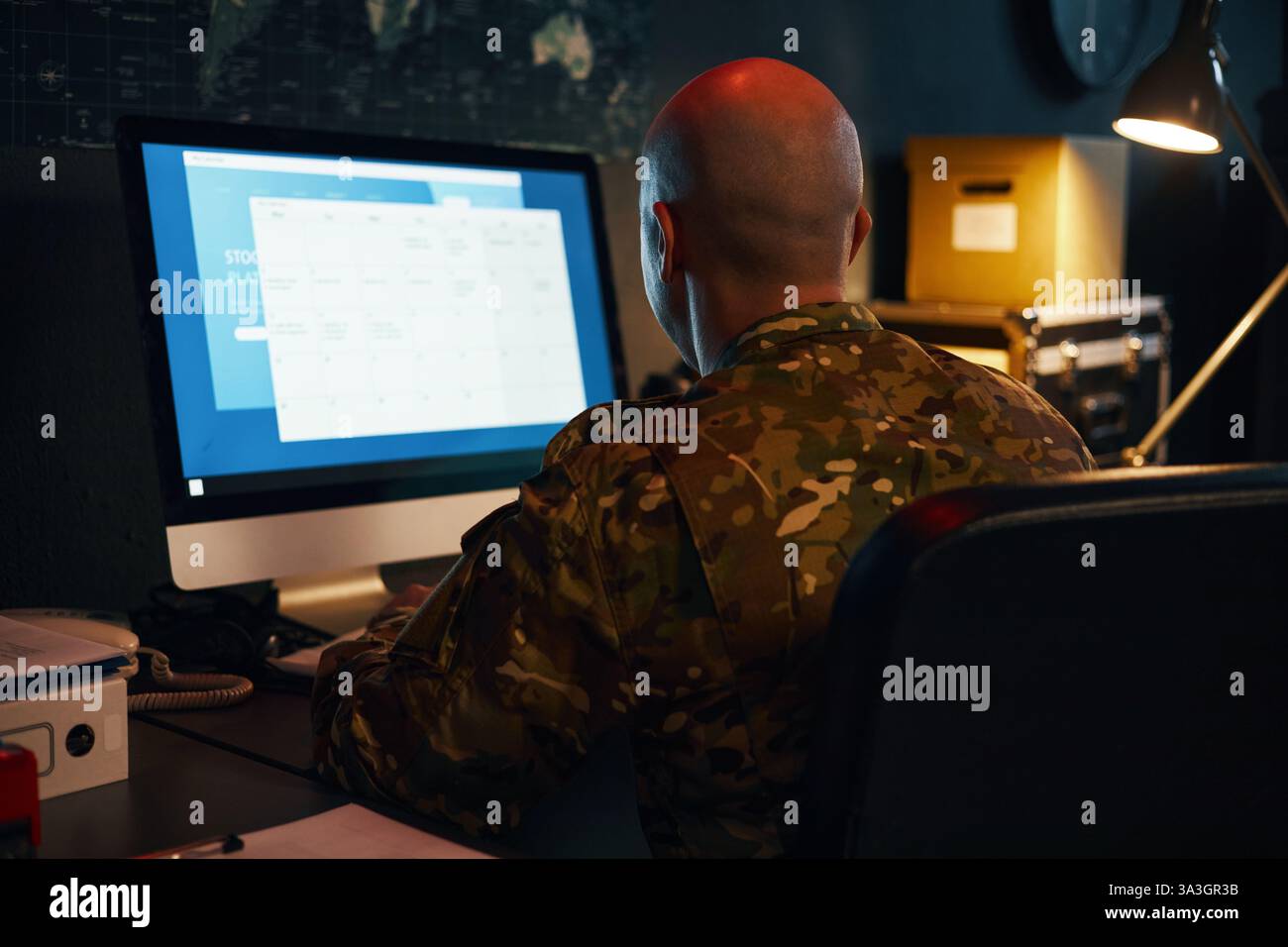 Wearing Camouflage Uniform and Working on Computer Stock Photo - Alamy