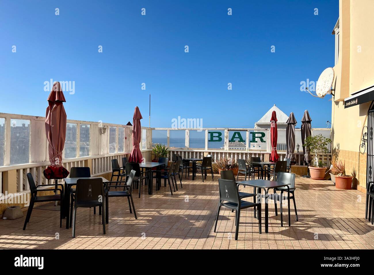 Outdoor Seating Area of a Small Bar in Playa Paraiso. Adeje, Tenerife, Canary Islands, Spain. 31st January 2025. - Smartphone Captured Stock Image