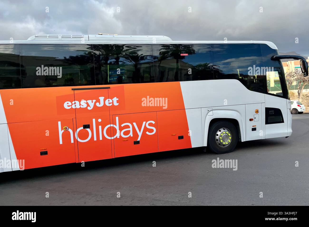 An EasyJet Holidays Bus driving through Costa Adeje. Tenerife, Canary Islands, Spain. 1st February 2025. - Smartphone Captured Stock Image