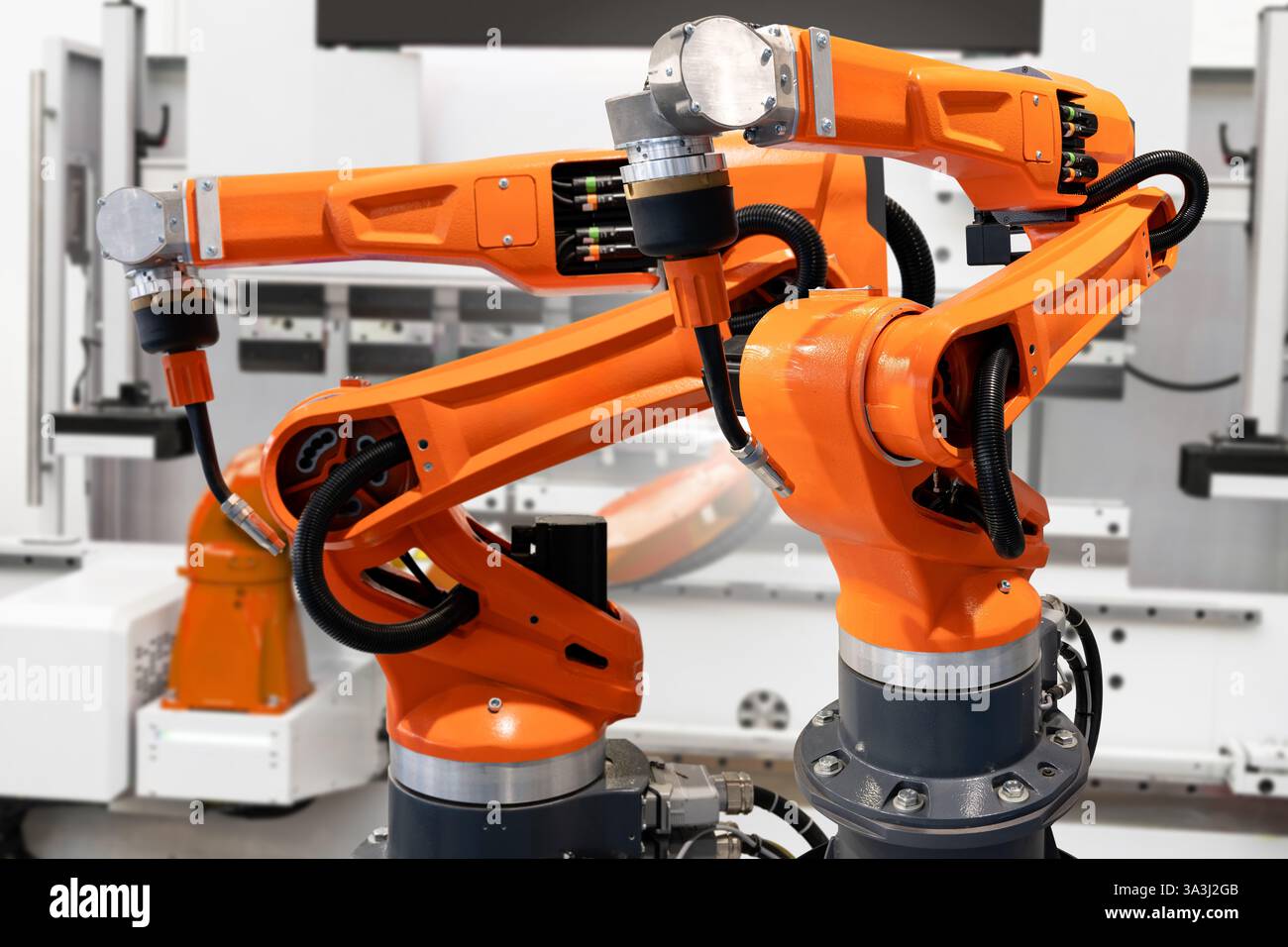 Automatic welding robots on a smart factory. Stock Photo