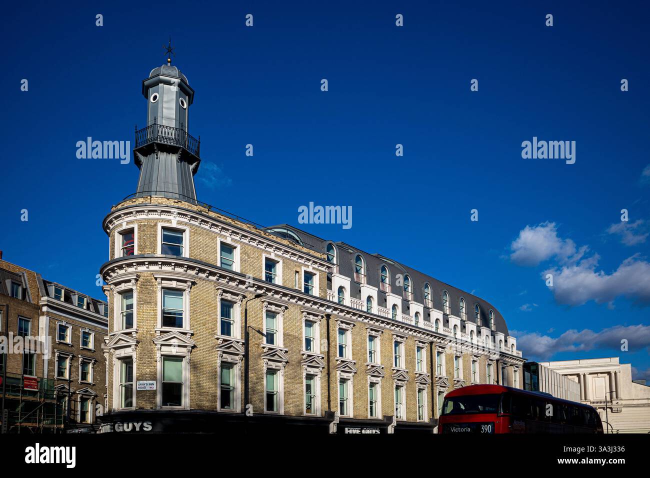 Lighthouse Building Kings Cross - a lighthouse stands on top of a terraced building near London's Kings Cross Station, possibly advertising Oyster Bar Stock Photo