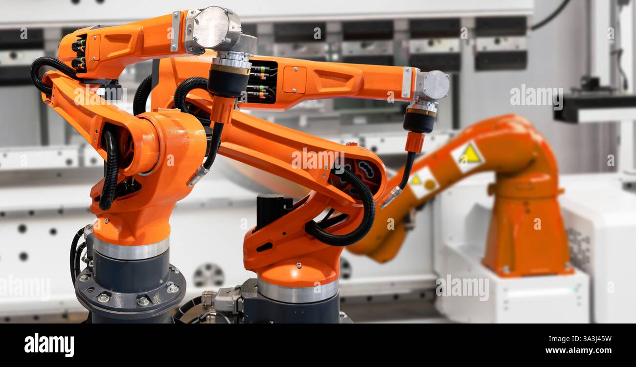 Automatic welding robots on a smart factory. Stock Photo