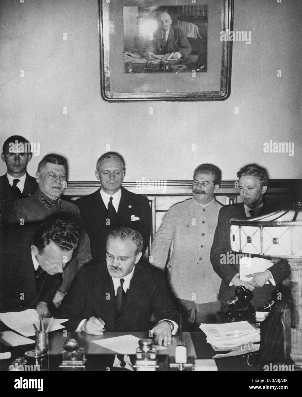 Vyacheslav Molotov signs the Molotov–Ribbentrop Pact, a German–Soviet non-aggression pact. Stock Photo