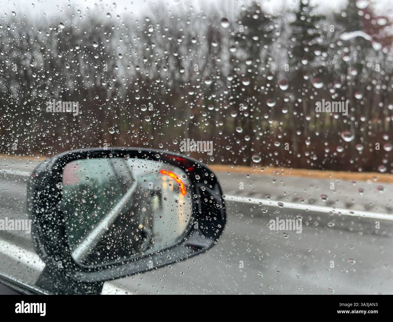 Power side view mirrors afford the driver access to blind spots while driving, 2024, Massachusetts, United States - Smartphone Captured Stock Image